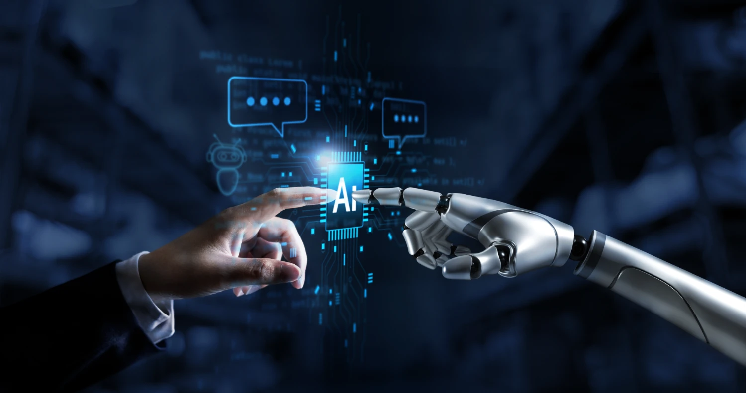 Une main humaine et une main robotique se touchent autour d'une puce « AI »